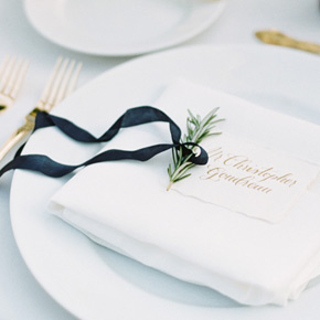 Placecard in gold galligraphy with rosemary and ribbon | Taryn Eklund Ink | Ashley Sawtelle Photography